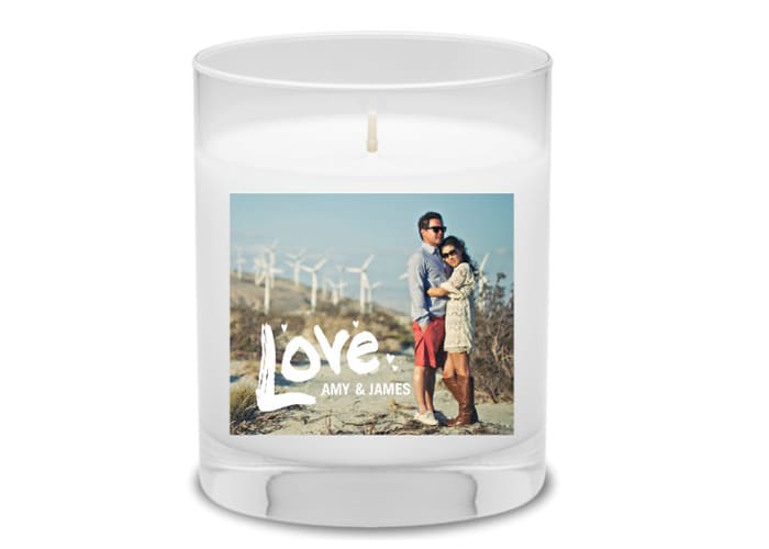 A personalized candle with a photo and the word love.