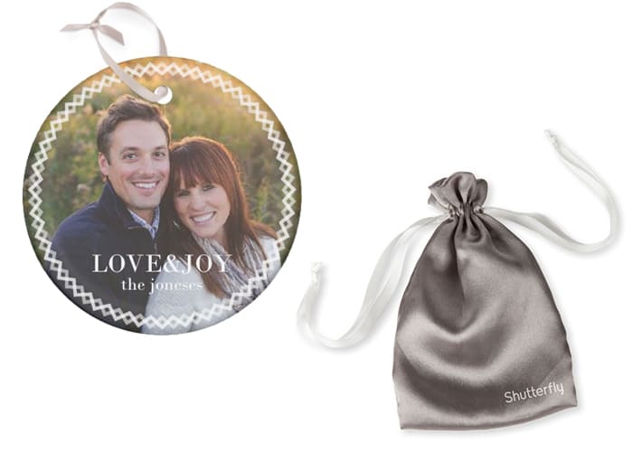 A glass photo ornament and shutterfly silk bag.