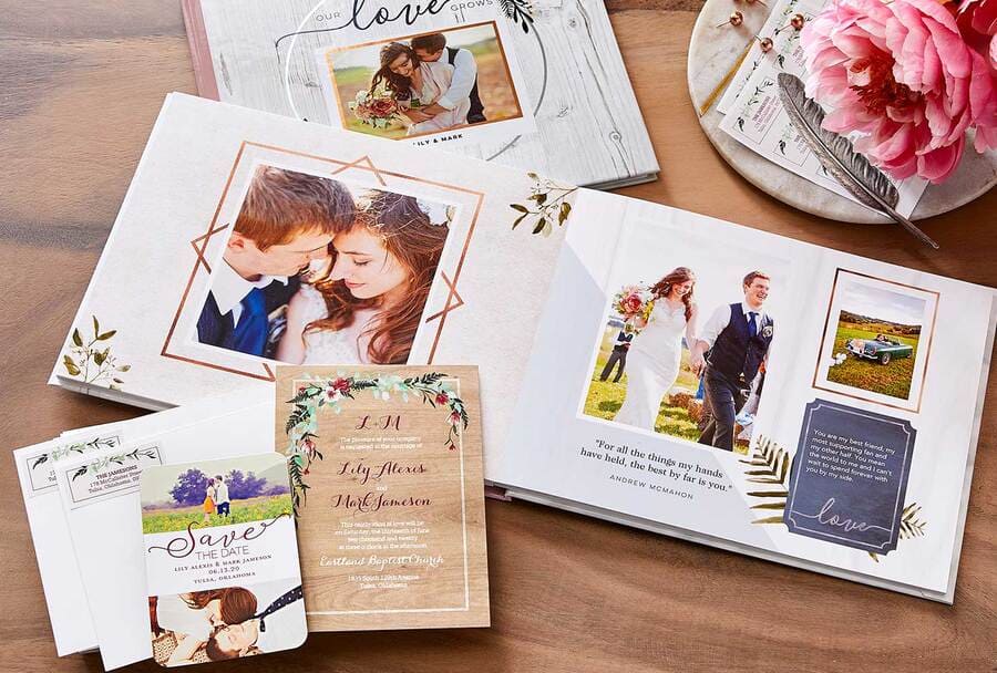 Wedding stationery on top of a wedding photo album